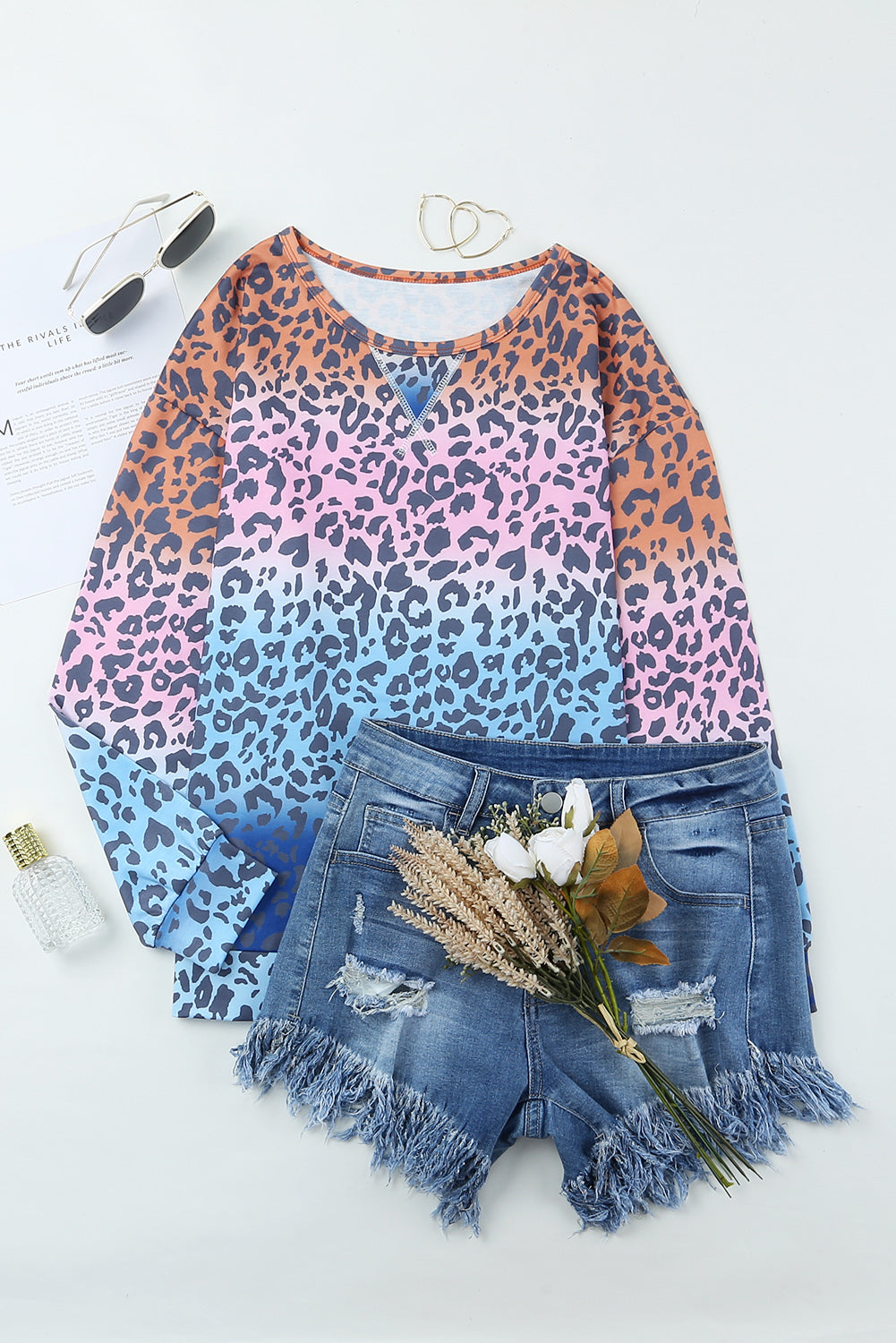 Multicolor gradient leopard print pullover sweatshirt showcasing vibrant colors and stylish design, perfect for casual wear.