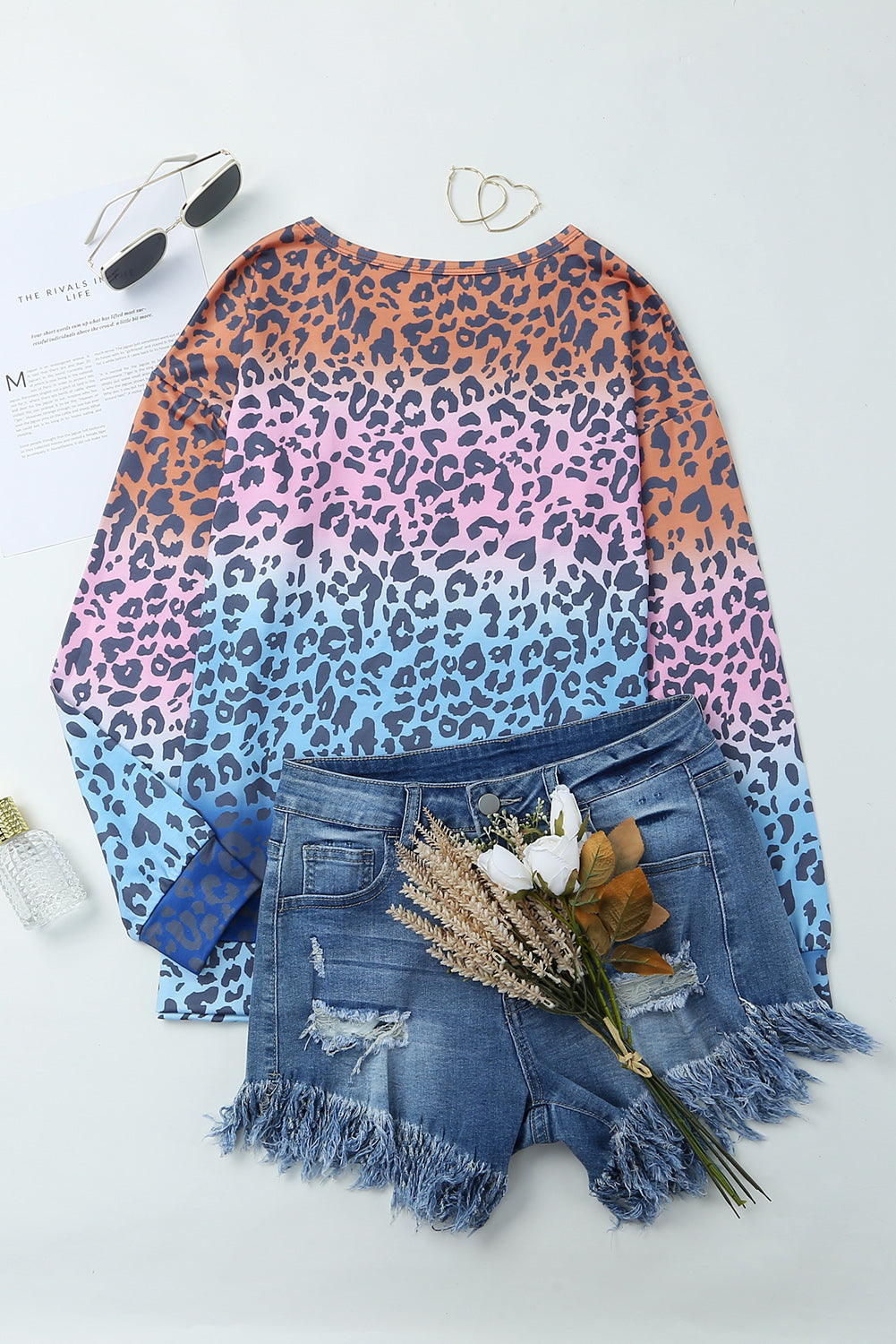 Multicolor gradient leopard print pullover sweatshirt showcasing vibrant colors and stylish design, perfect for casual wear.