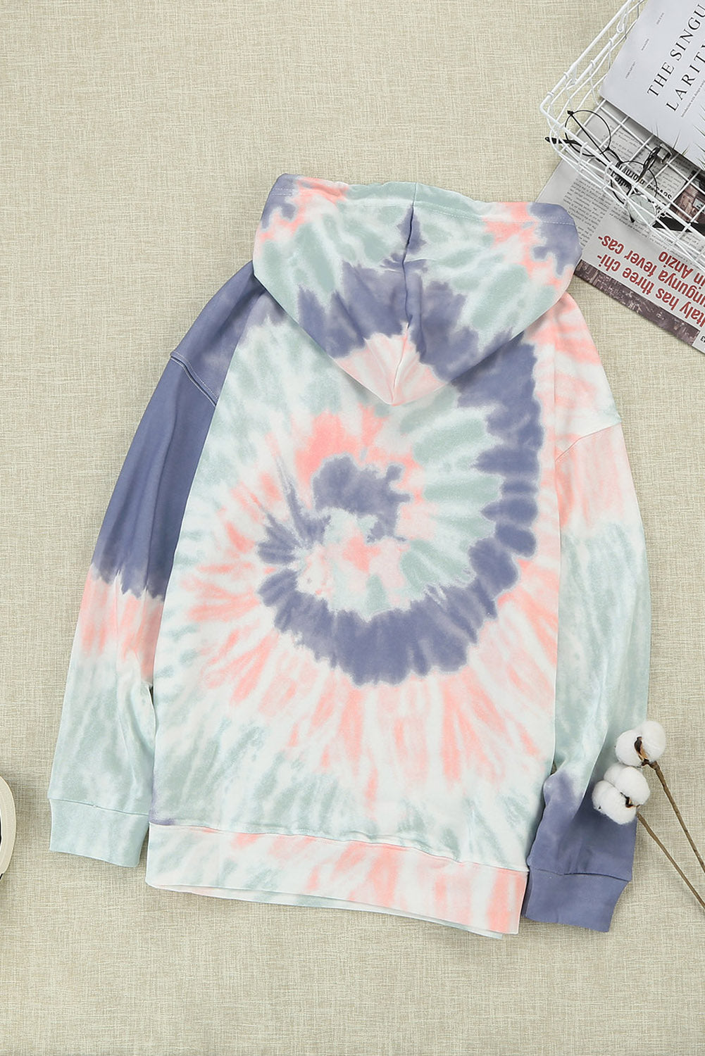 Multicolor tie-dye print pullover hoodie displayed on a mannequin, showcasing vibrant colors and a cozy design.