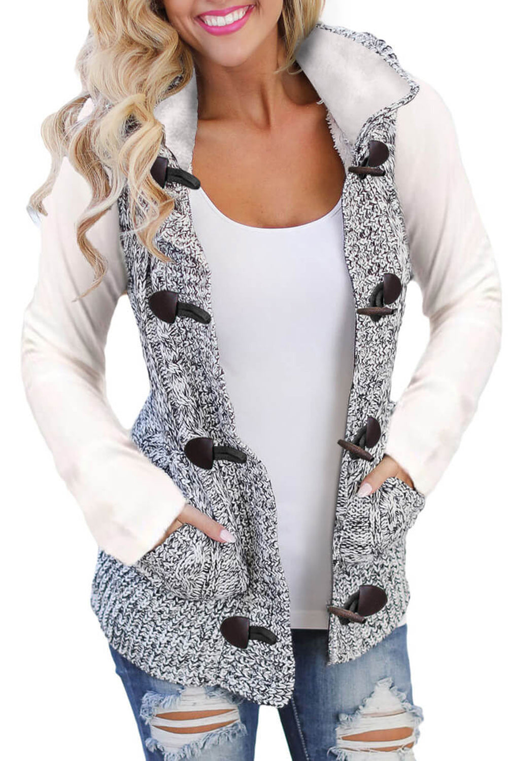 A cozy multicolour cable knit hooded sweater vest with an open front and button-down design, featuring side pockets.