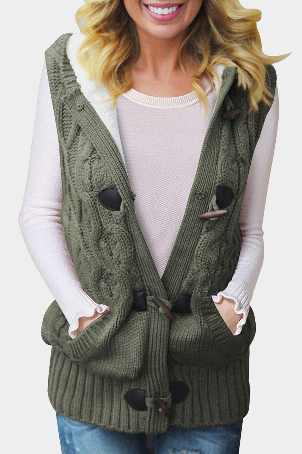 A cozy multicolour cable knit hooded sweater vest with an open front and button-down design, featuring side pockets.