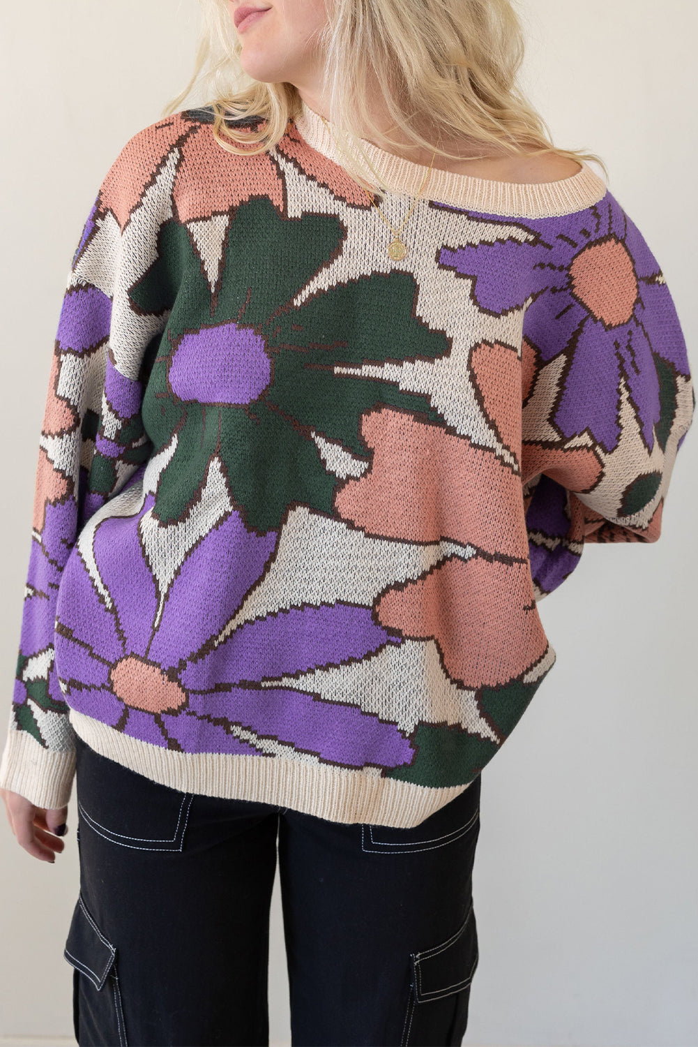 A cozy multicolour flower print loose sweater, featuring vibrant floral designs, perfect for chilly days.