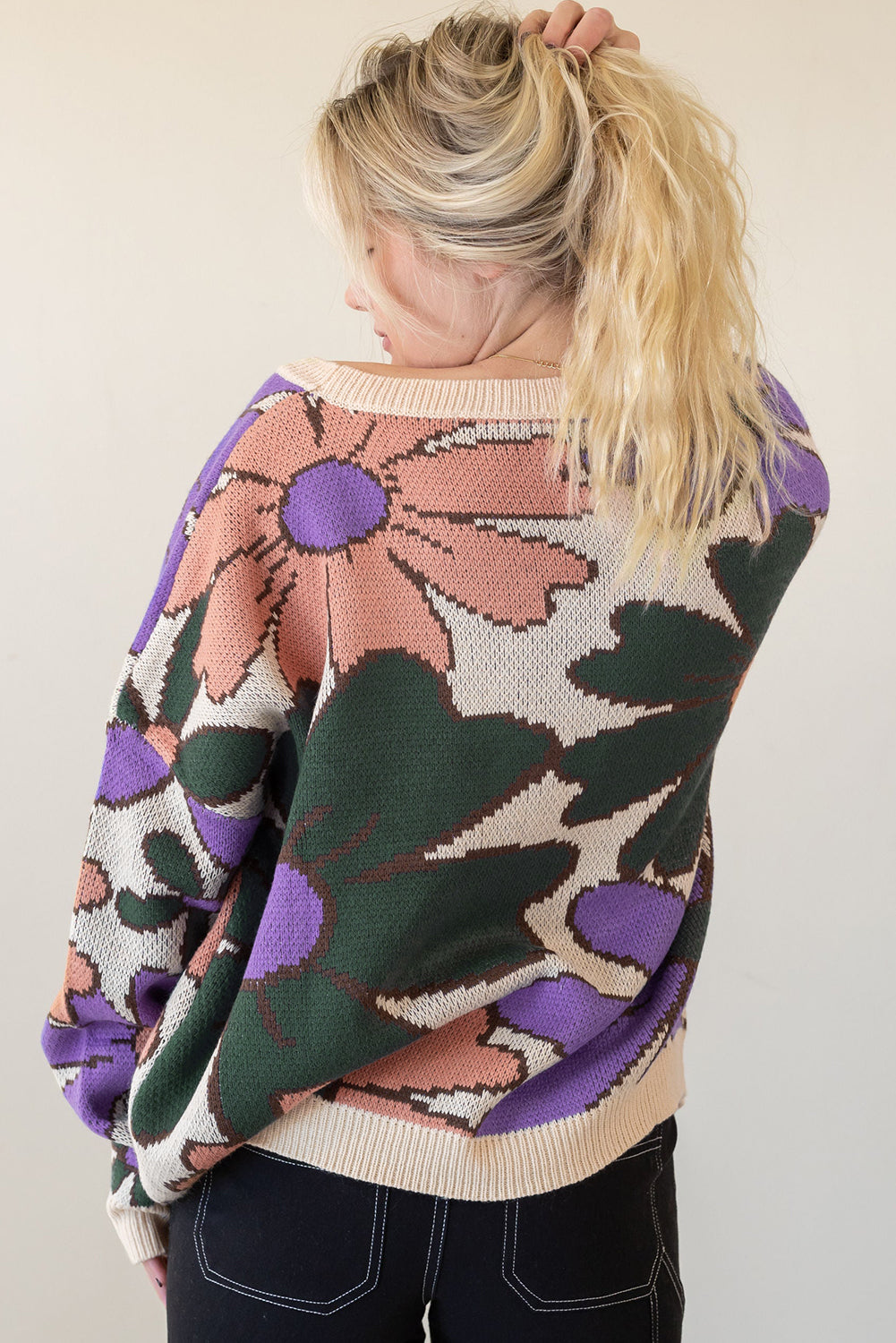 A cozy multicolour flower print loose sweater, featuring vibrant floral designs, perfect for chilly days.