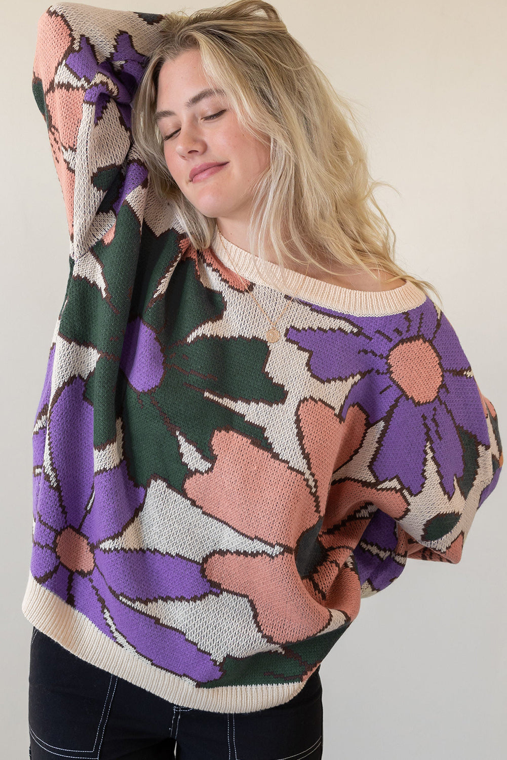 A cozy multicolour flower print loose sweater, featuring vibrant floral designs, perfect for chilly days.