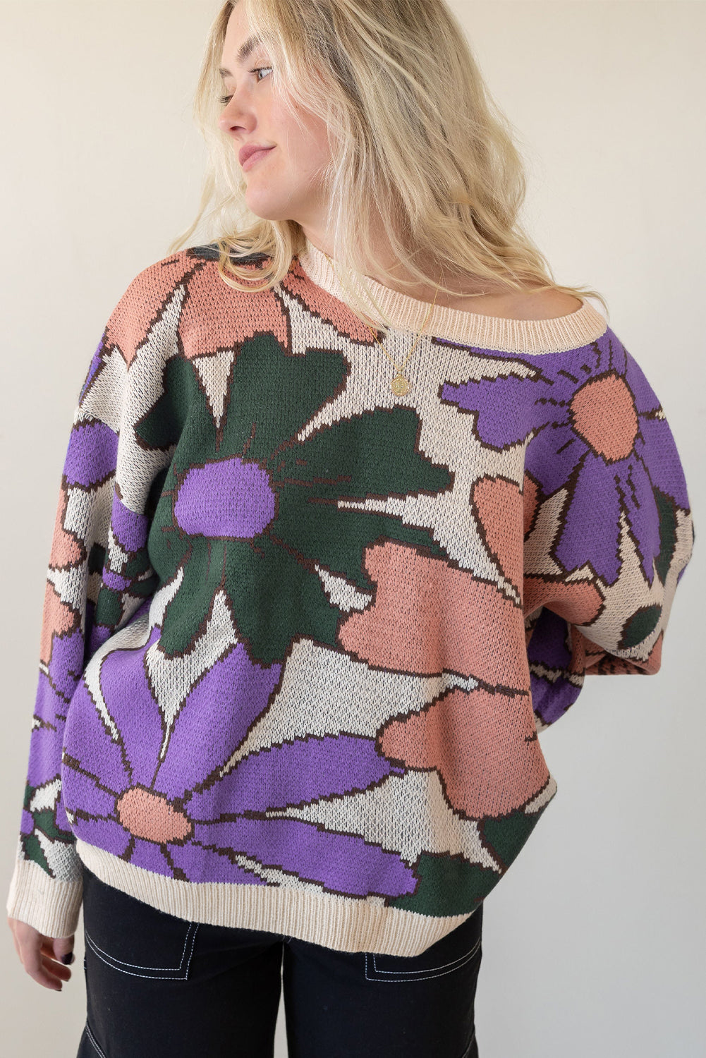 A cozy multicolour flower print loose sweater, featuring vibrant floral designs, perfect for chilly days.