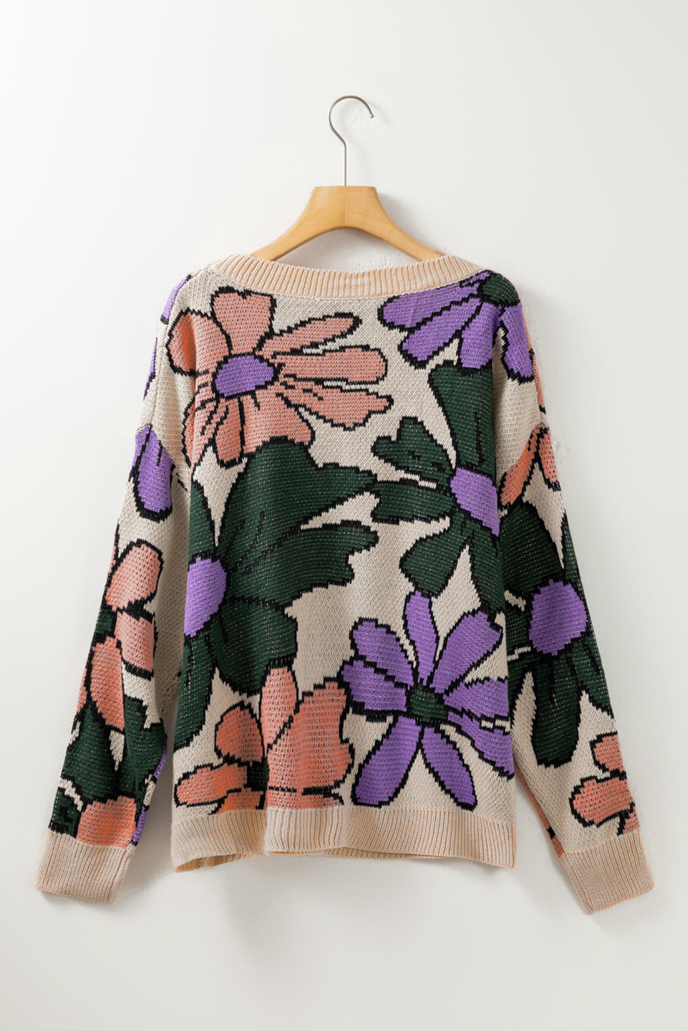 A cozy multicolour flower print loose sweater, featuring vibrant floral designs, perfect for chilly days.