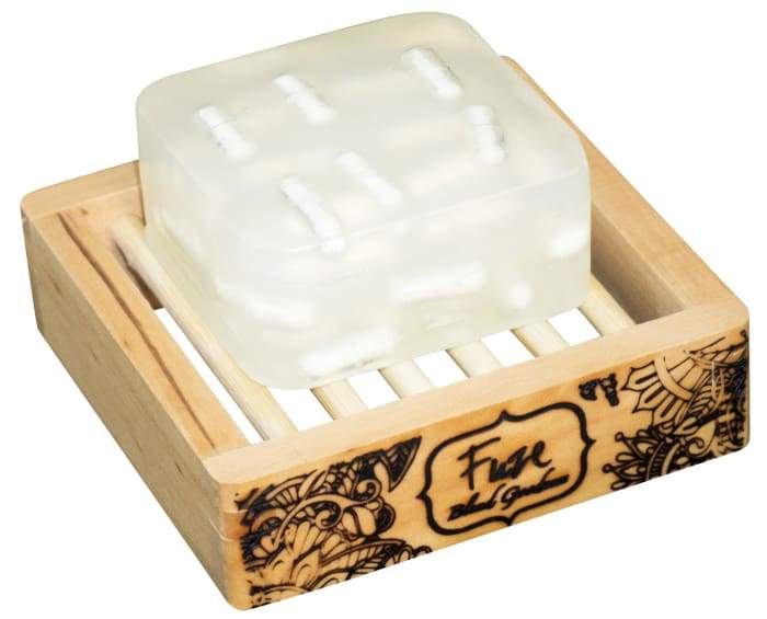 Muscle Milk Burst Bar with essential oils and fizzing action, displayed on a wooden soap dish.