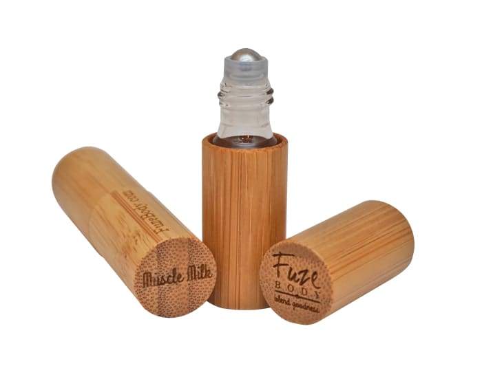 Wood Roll-On bottle filled with pure essential oils for muscle recovery, featuring a sleek design and easy-to-use applicator.