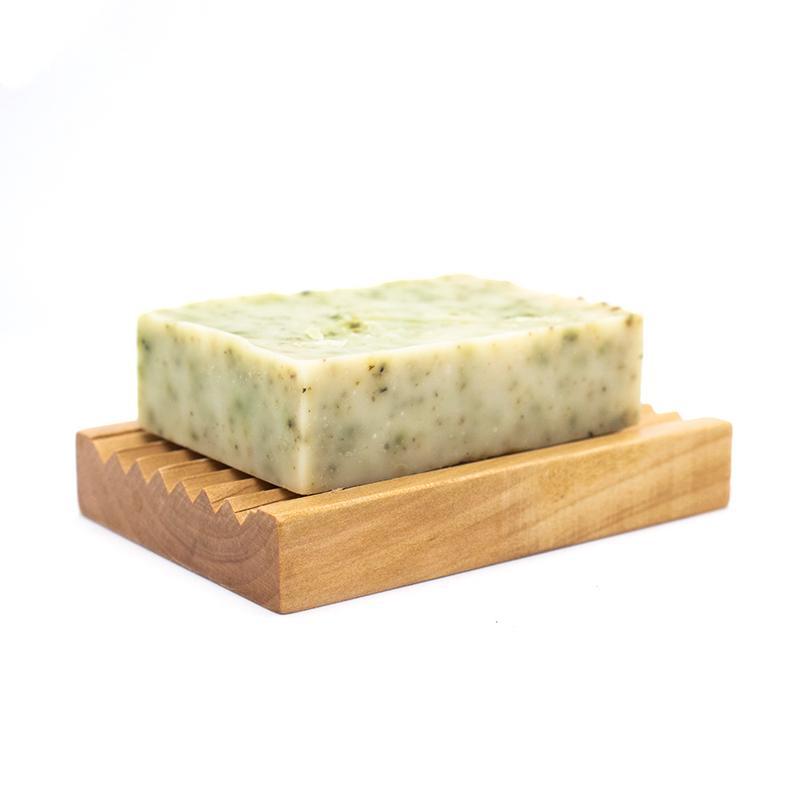 Naked Soap Organic Soap 90g with nettles, showcasing its natural ingredients and green flecks.