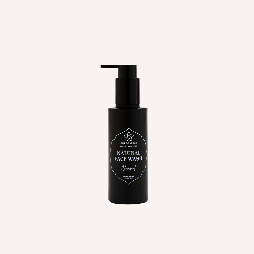 Art of Vedas Natural Face Wash with activated charcoal in a sleek bottle, showcasing its natural and vegan formula for radiant skin.