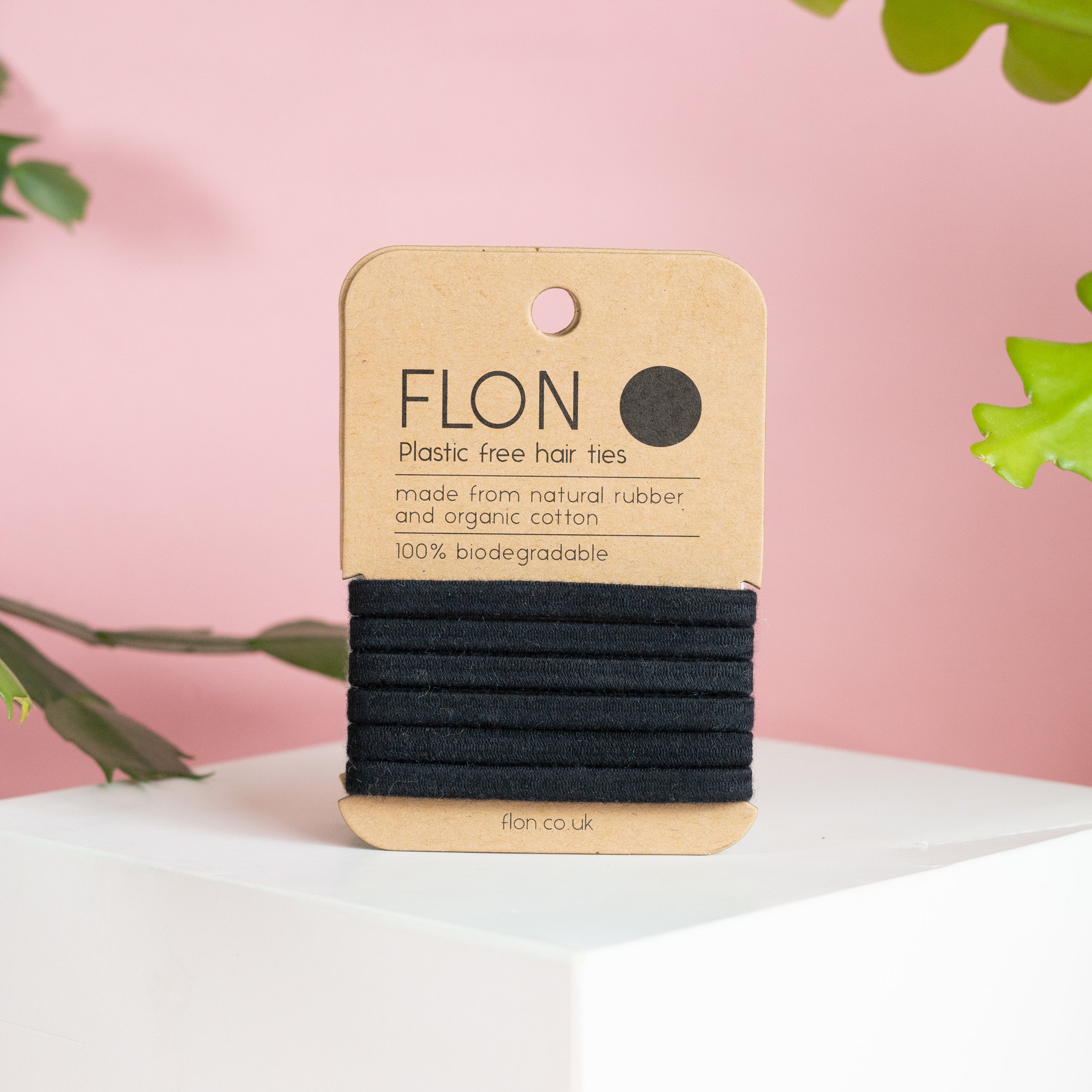 A pack of six eco-friendly natural rubber hair ties made from cotton and rubber, showcasing their soft texture and durability.