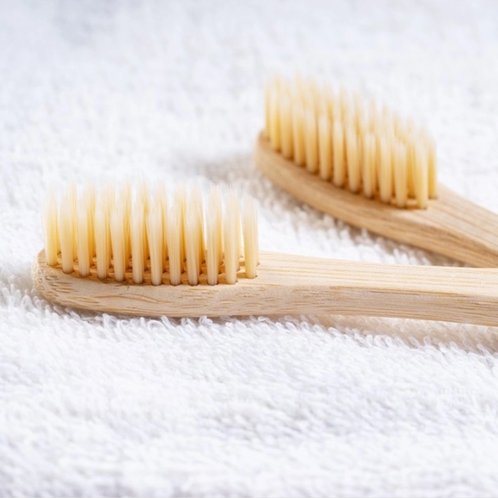 Natural Wood Toothbrush made from bamboo with soft bristles, ideal for eco-conscious users.