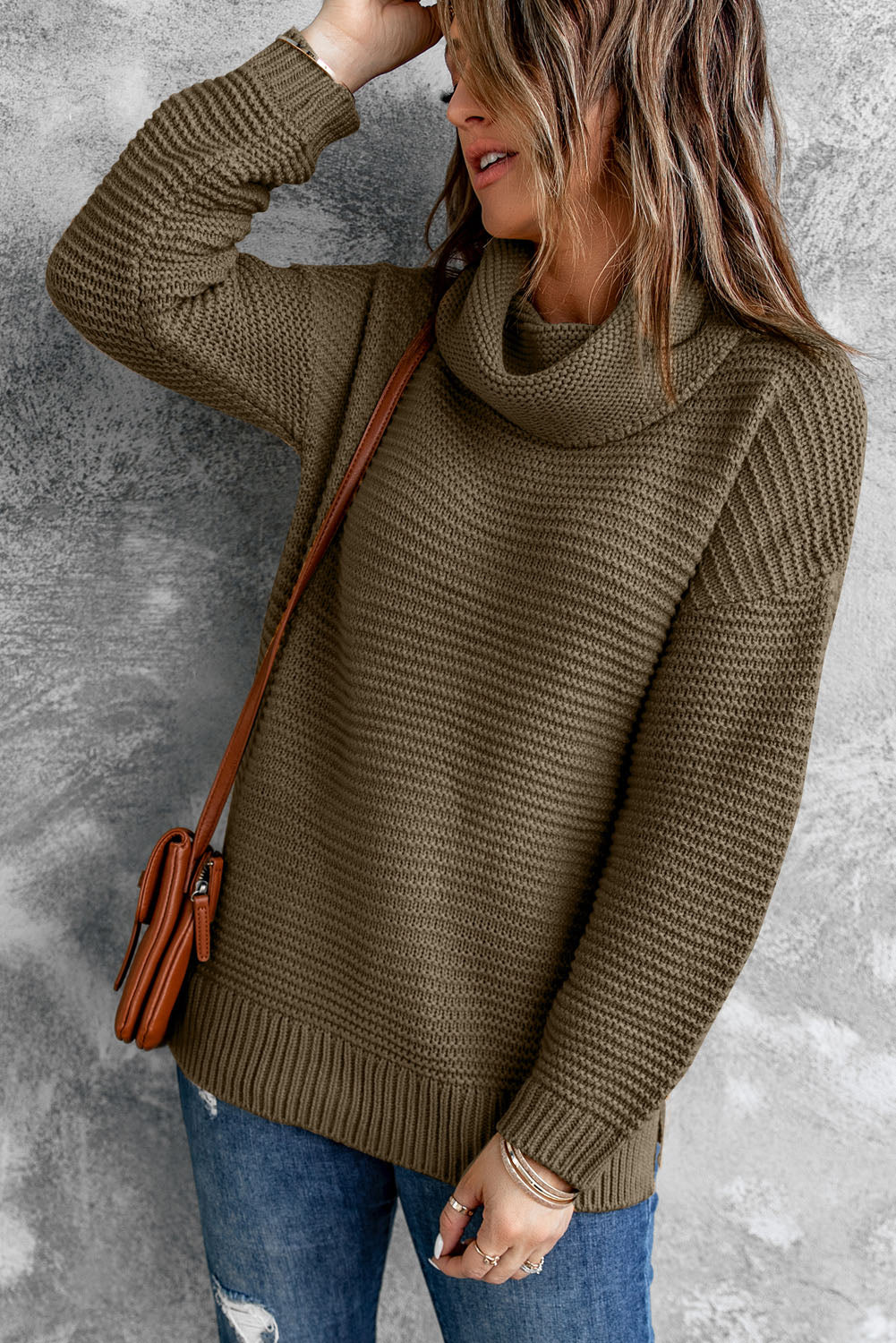 A cozy navy long sleeves turtleneck sweater displayed on a mannequin, showcasing its soft fabric and elegant design.