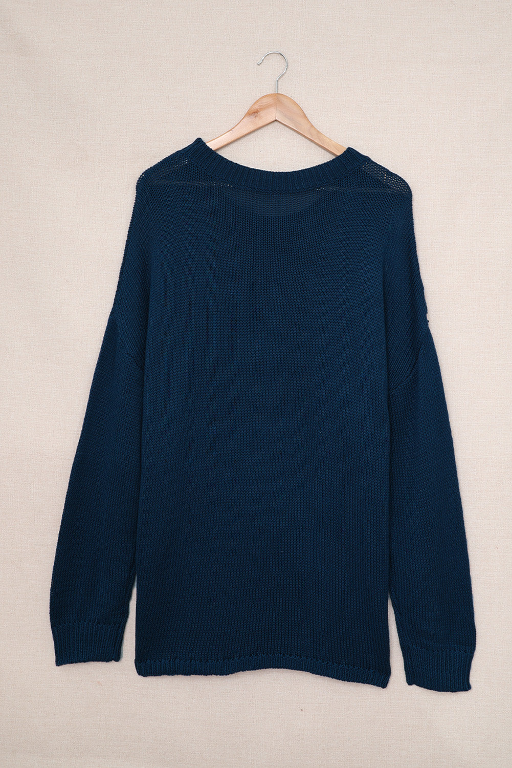 A cozy navy long sleeves turtleneck sweater displayed on a mannequin, showcasing its soft fabric and elegant design.