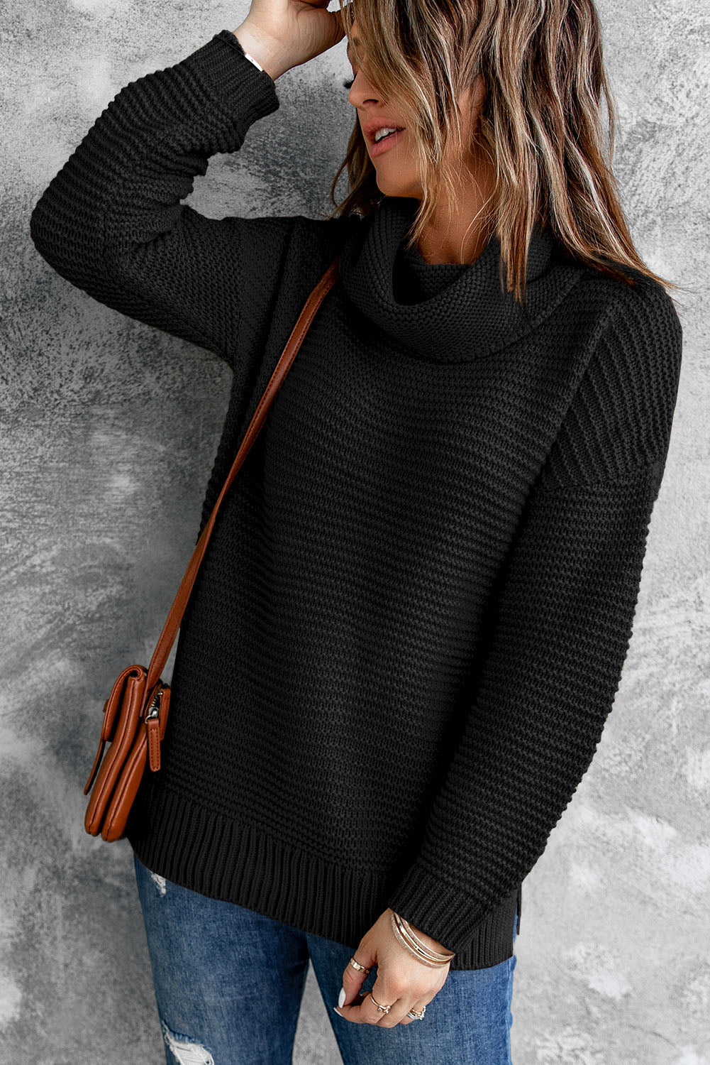 A cozy navy long sleeves turtleneck sweater displayed on a mannequin, showcasing its soft fabric and elegant design.