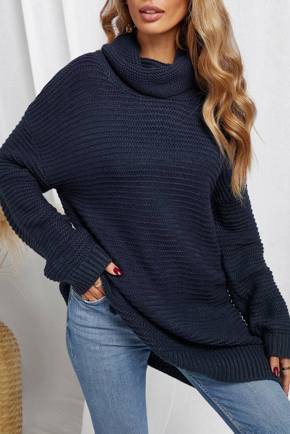 A cozy navy long sleeves turtleneck sweater displayed on a mannequin, showcasing its soft fabric and elegant design.