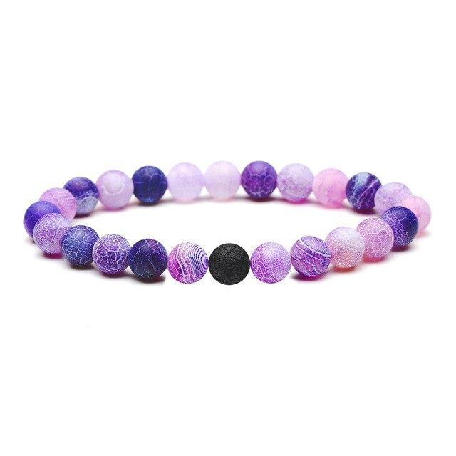 A vibrant Neon Purple Lava Stone Bracelet showcasing natural lava stones, perfect for absorbing essential oils.