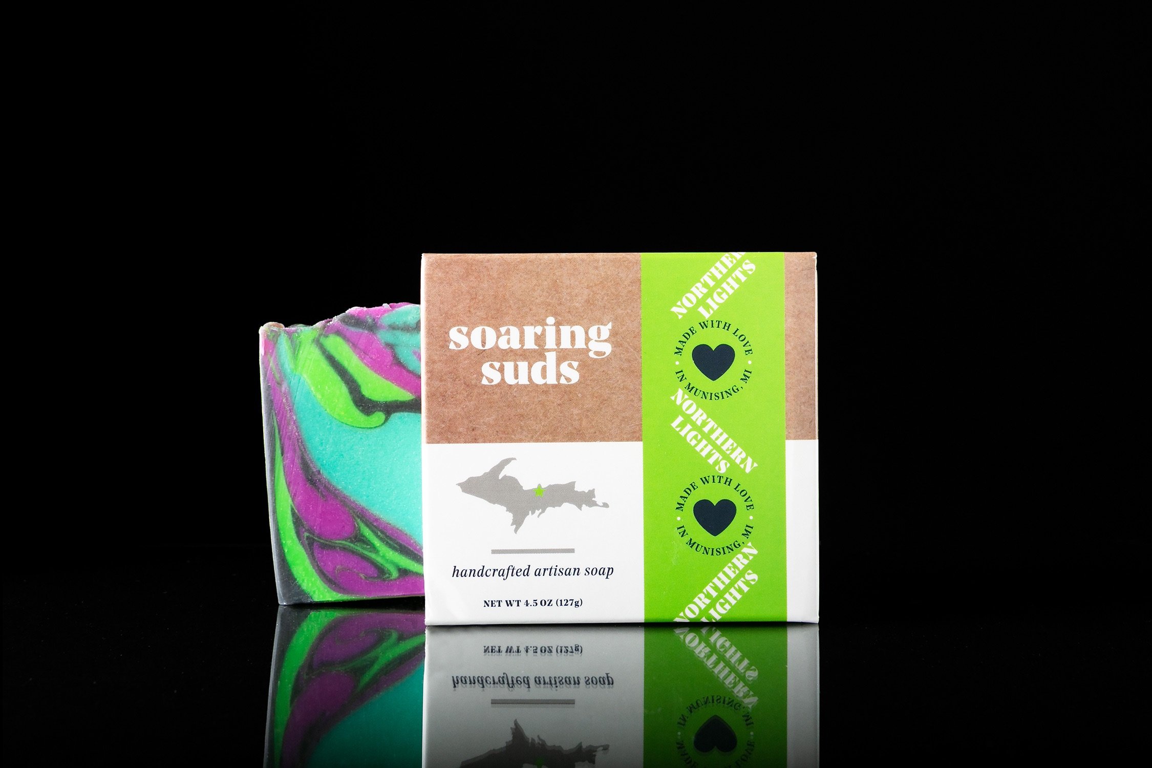 Northern Lights Soap bar with vibrant colors and tropical fruit scent, handcrafted and unique in design.