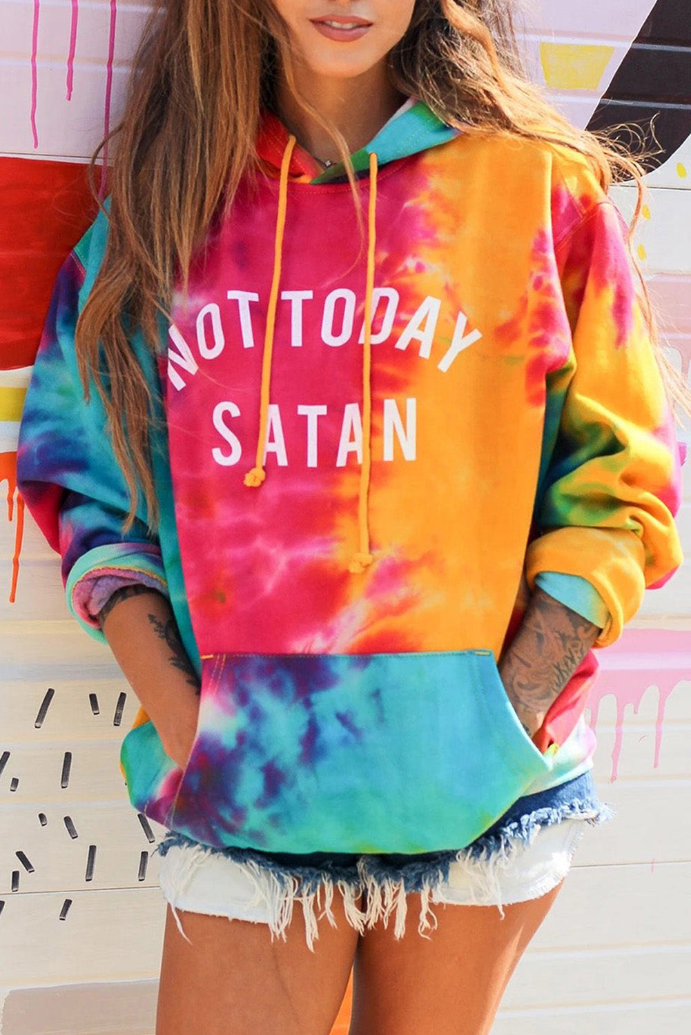 A colorful tie-dye hoodie featuring the phrase 'Not Today Satan' in white text, showcasing a unique blend of vibrant colors.