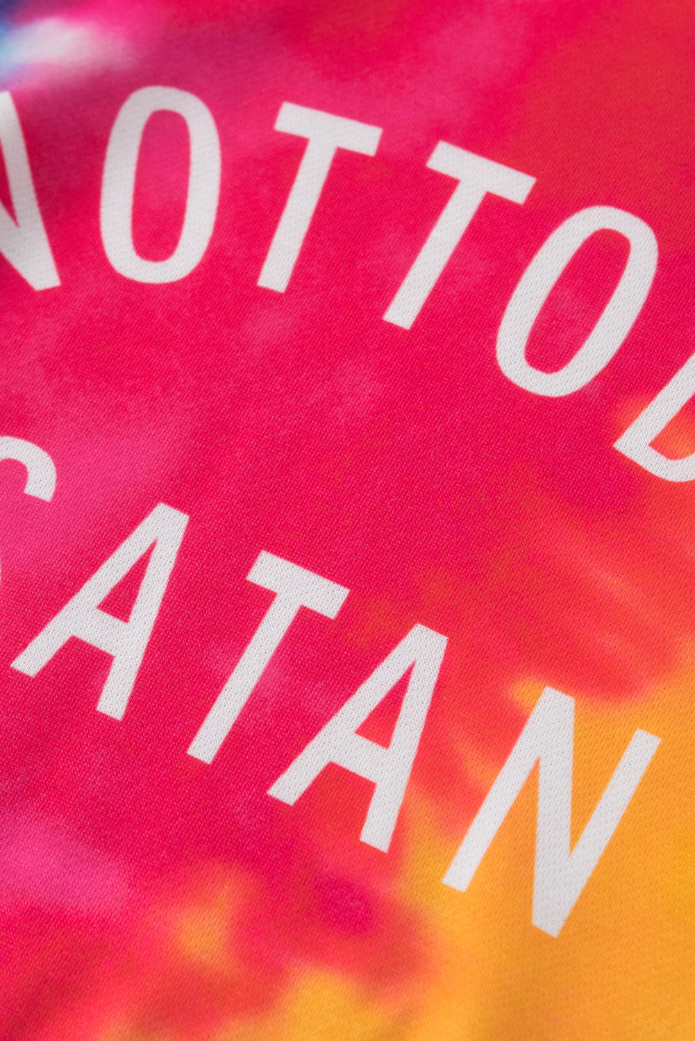 A colorful tie-dye hoodie featuring the phrase 'Not Today Satan' in white text, showcasing a unique blend of vibrant colors.