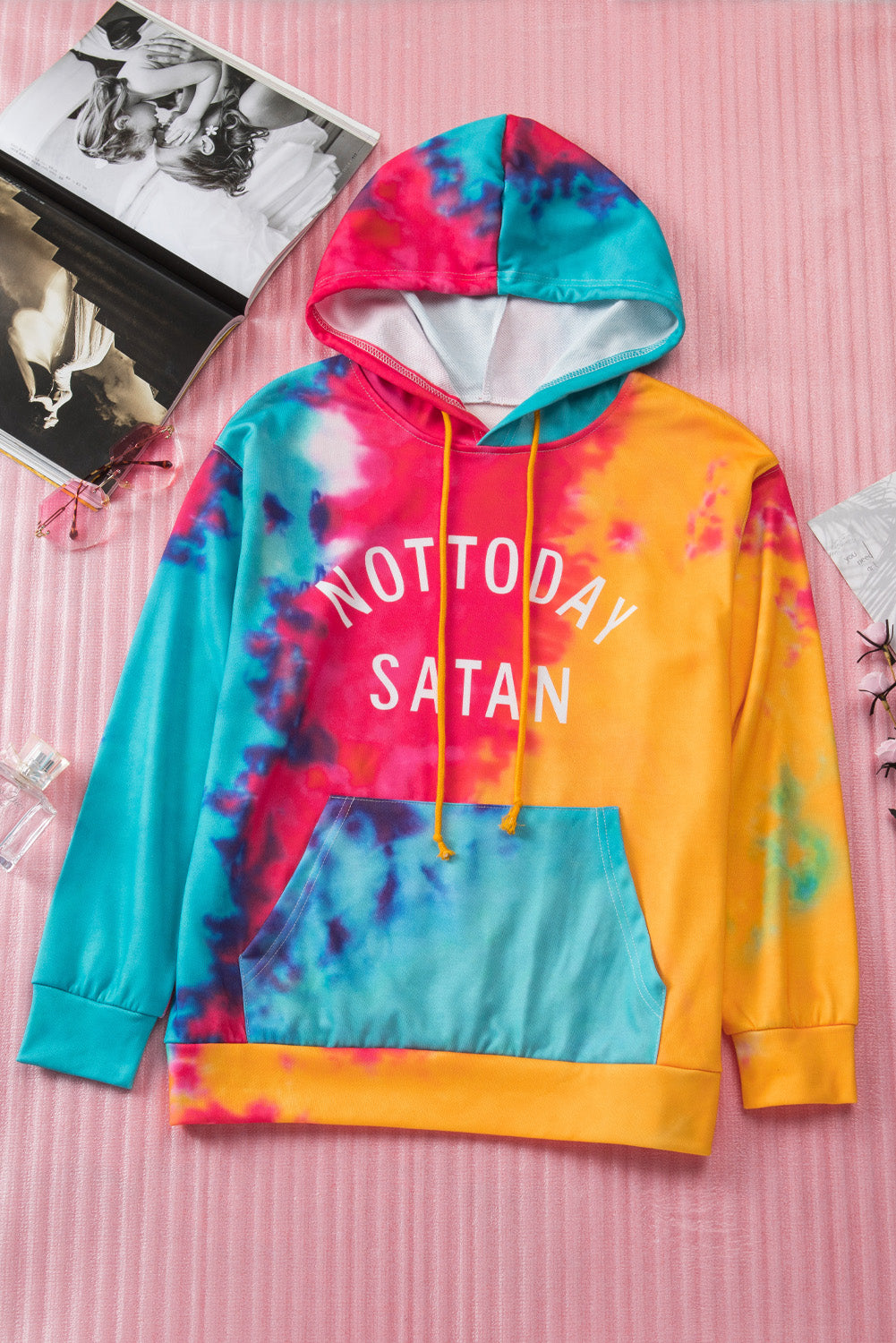 A colorful tie-dye hoodie featuring the phrase 'Not Today Satan' in white text, showcasing a unique blend of vibrant colors.