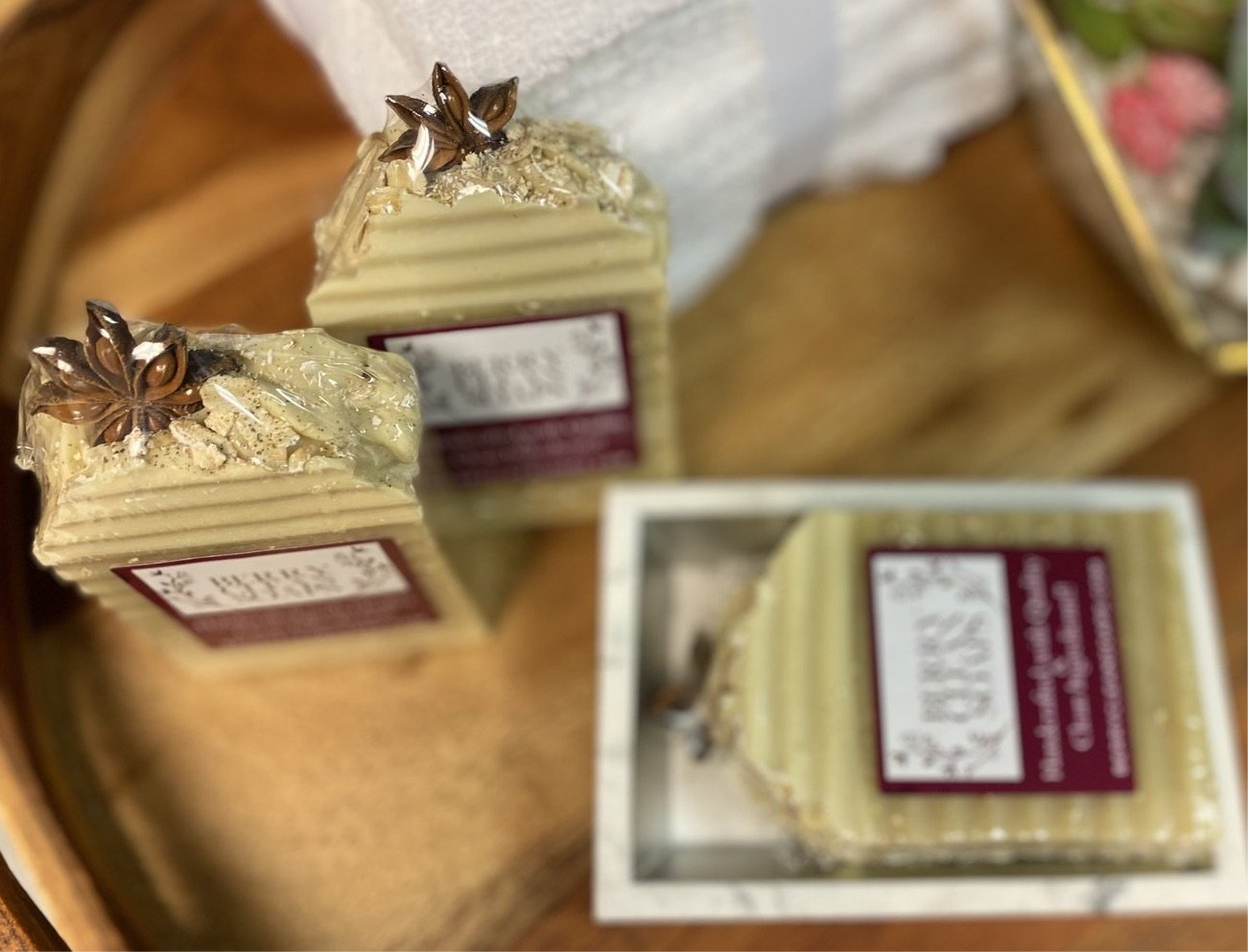 Oatmeal Milk & Honey Anise Soap bar with natural ingredients, showcasing its creamy texture and gentle exfoliating properties.