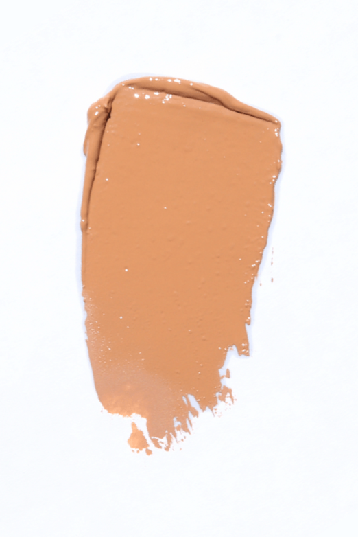 Obsession makeup product in caramel tone, showcasing its creamy texture and packaging.