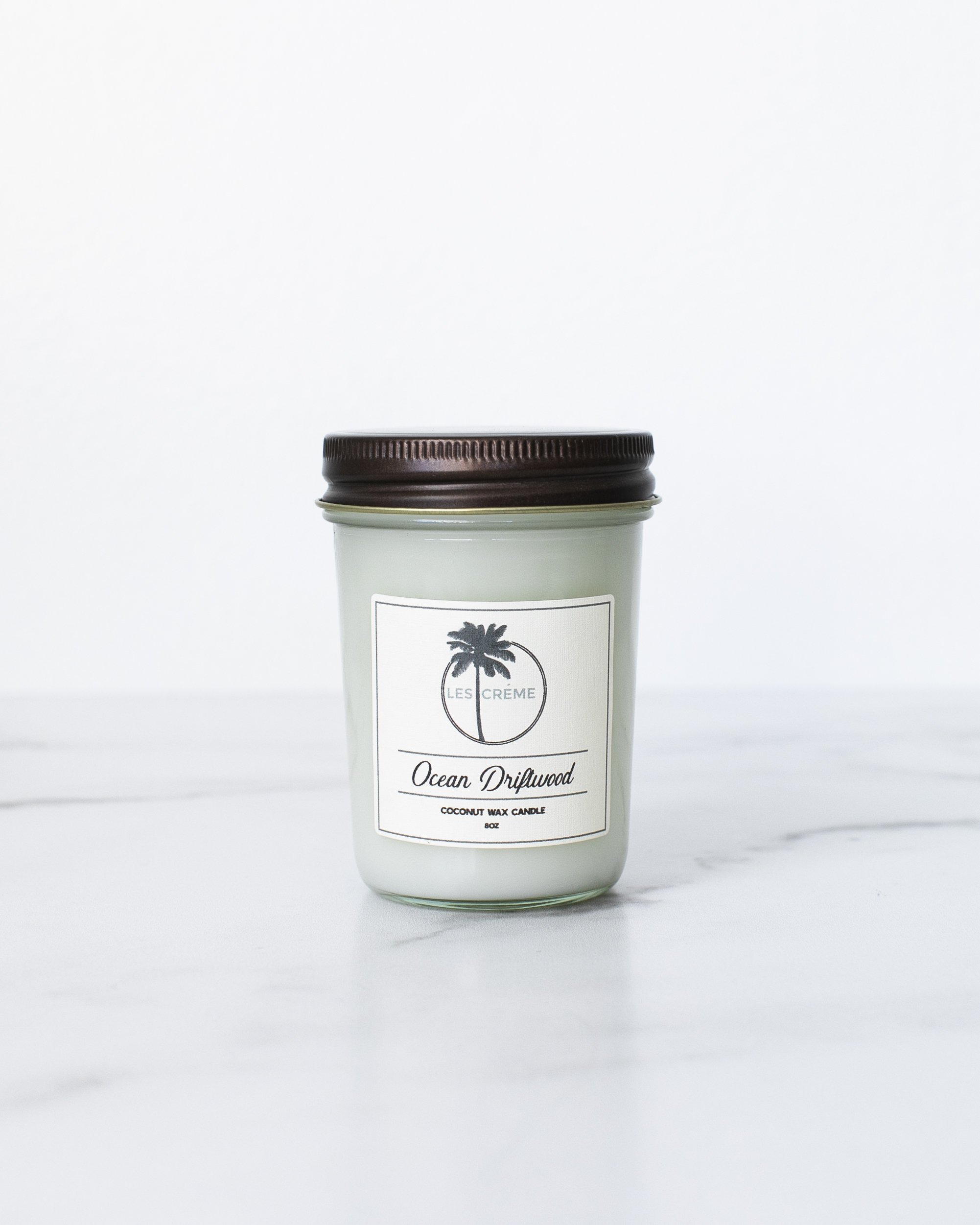 Ocean Driftwood Scent Coconut Wax Candle in a stylish jar, showcasing its natural coconut wax and cotton wick, perfect for home decor.