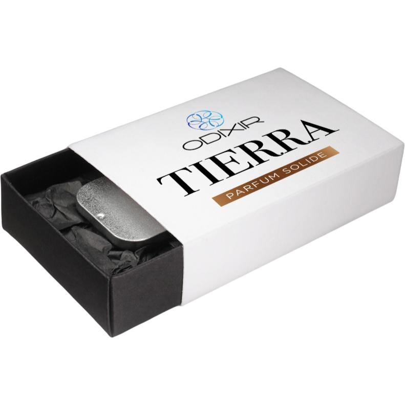 ODIXIR™ Parfum Solide Tierra solid perfume in an elegant case, showcasing its natural ingredients and luxurious design.