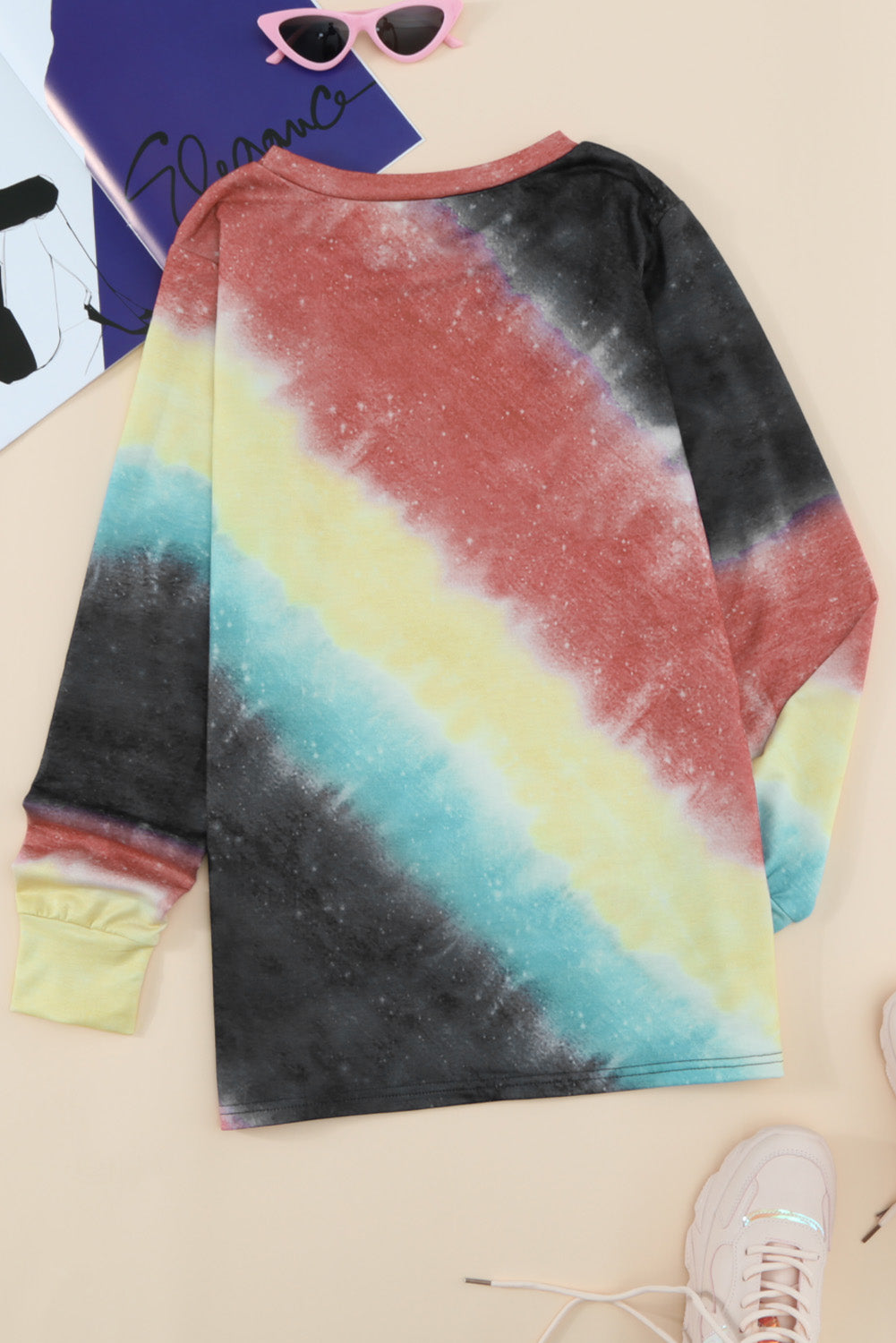 Ombre Fiery Red Tie-dye Long Sleeve Top displayed on a mannequin, showcasing its vibrant colors and stylish design.