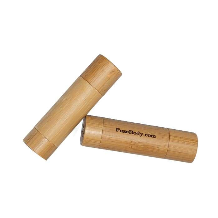 Organic Oral Health Lip Balm in bamboo dispenser, featuring natural ingredients like coconut oil and essential oils for lip care.