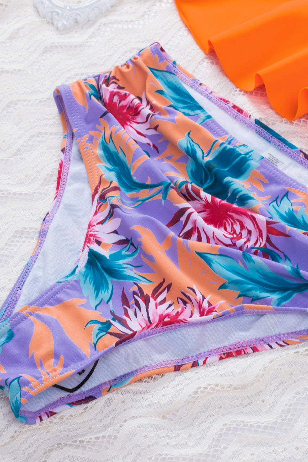 Orange Floral Frill Bikini Set featuring a ruffled hem bikini top and floral swim panty, perfect for summer beach outings.