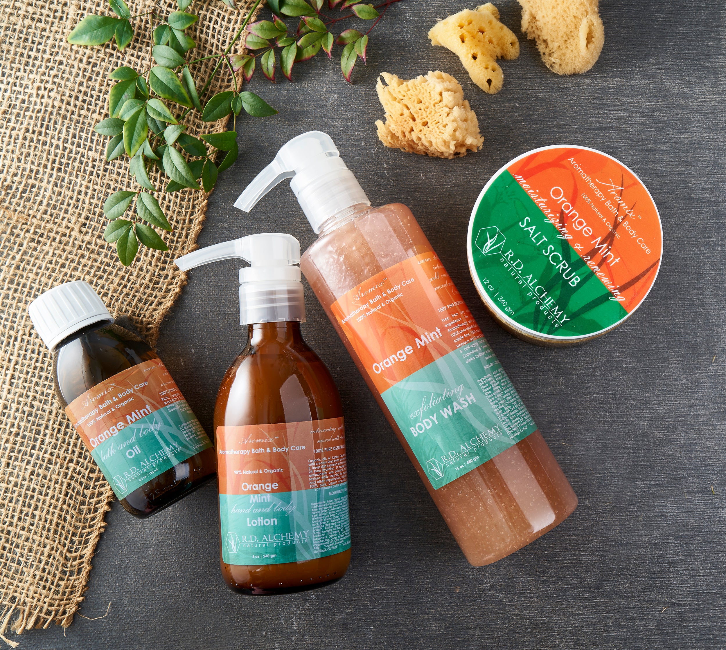 Orange Mint Body Care Set featuring four skincare products with citrus mint scent for glowing skin.