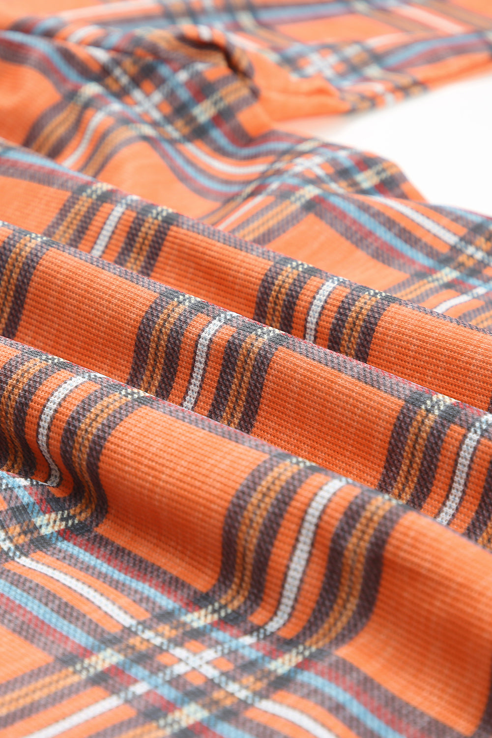 Orange plus size plaid long sleeve shirt with chest pockets and button-up front, perfect for casual wear.