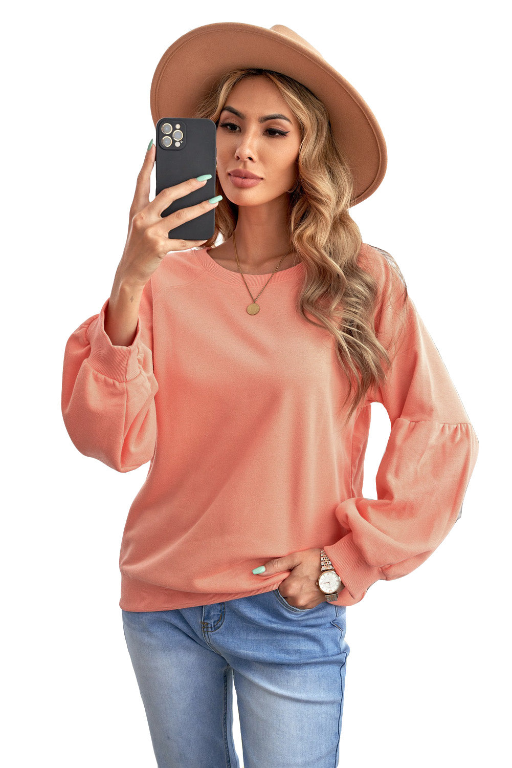 Orange pullover sweatshirt with patchwork raglan sleeves, showcasing a trendy and stylish design suitable for casual wear.