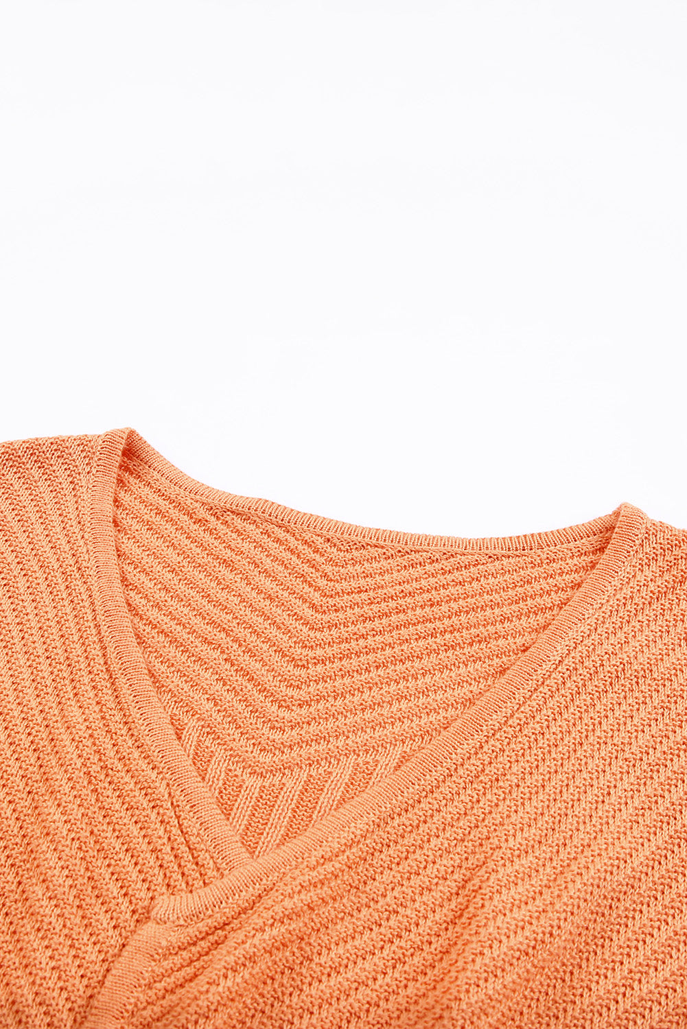 A vibrant orange ribbed open front knit cardigan displayed on a mannequin, showcasing its long sleeves and casual style.