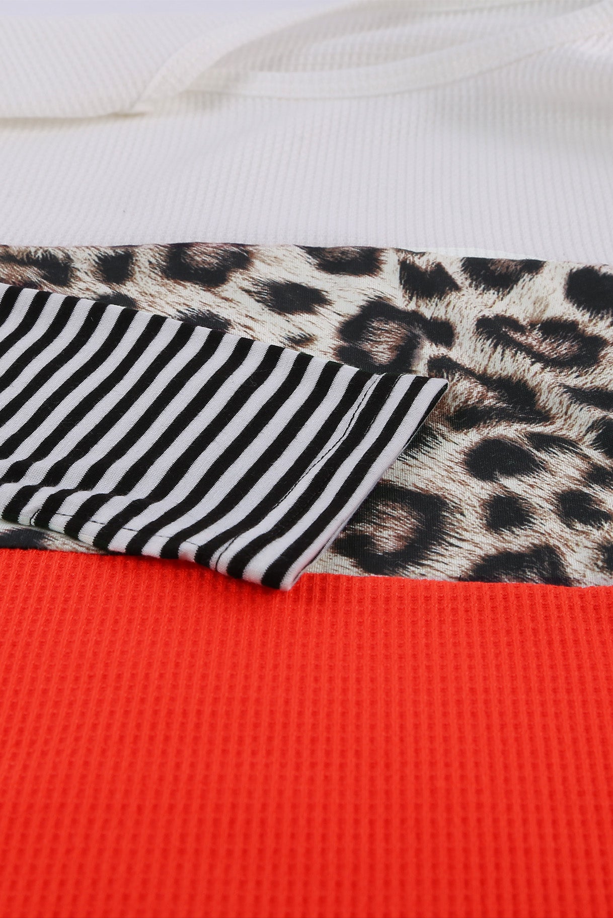 Orange Stripes Leopard Splicing Colorblock Long Sleeve Top featuring trendy color blocking and leopard print accents.