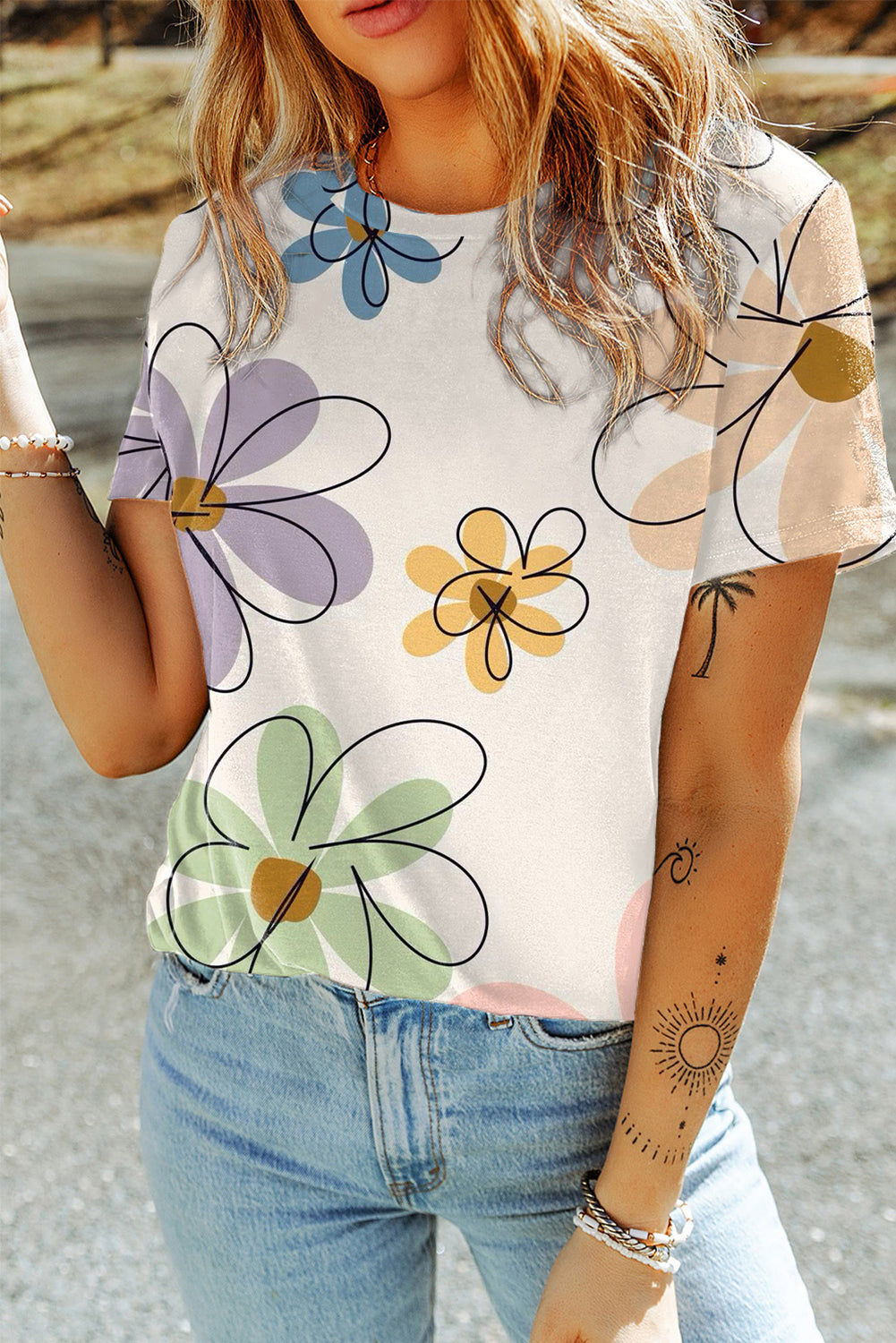 A vibrant orange t-shirt featuring a summer flower print, showcasing a casual round neck design, perfect for warm weather wear.