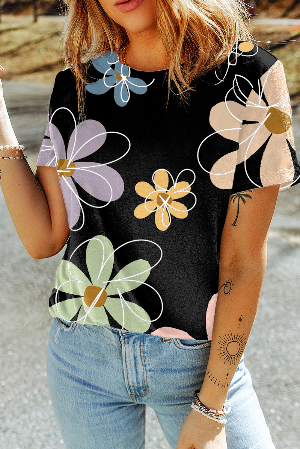 A vibrant orange t-shirt featuring a summer flower print, showcasing a casual round neck design, perfect for warm weather wear.