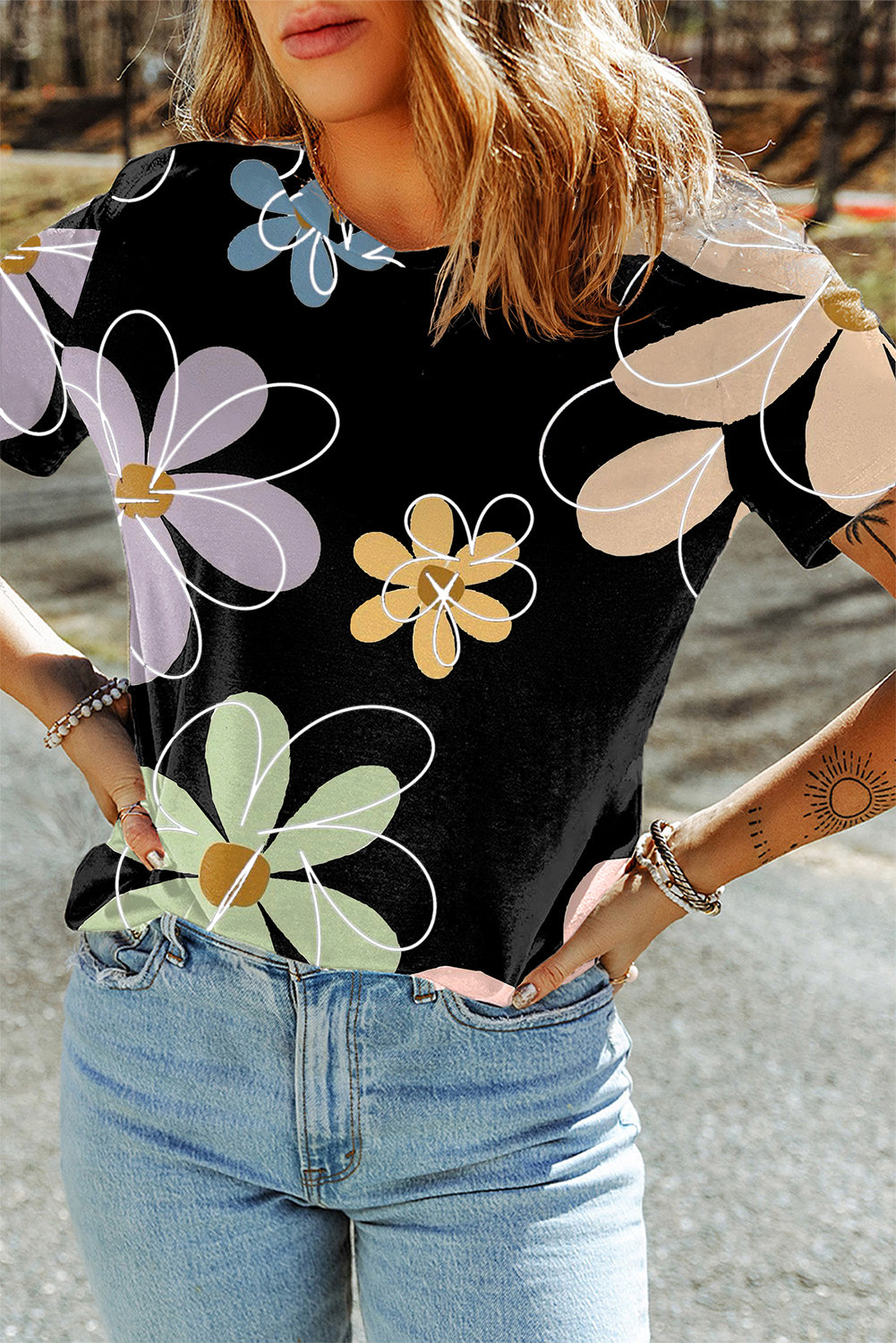 A vibrant orange t-shirt featuring a summer flower print, showcasing a casual round neck design, perfect for warm weather wear.