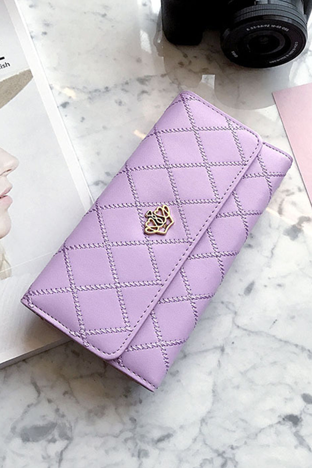 Orchid Petal Crown Decor Quilted Trifold Clutch in faux leather, featuring an elegant design with a quilted texture and decorative crown.