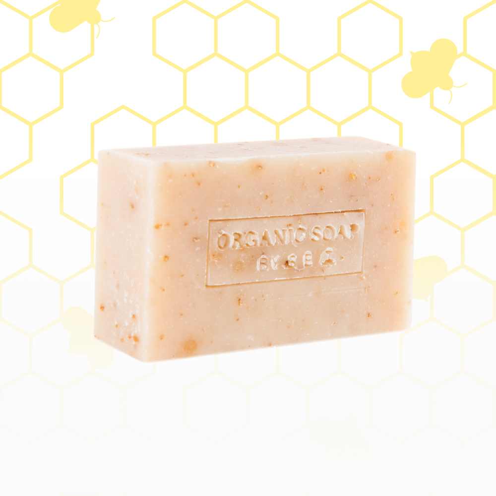 A collection of organic bar soaps in various scents, showcasing their natural ingredients and eco-friendly packaging.