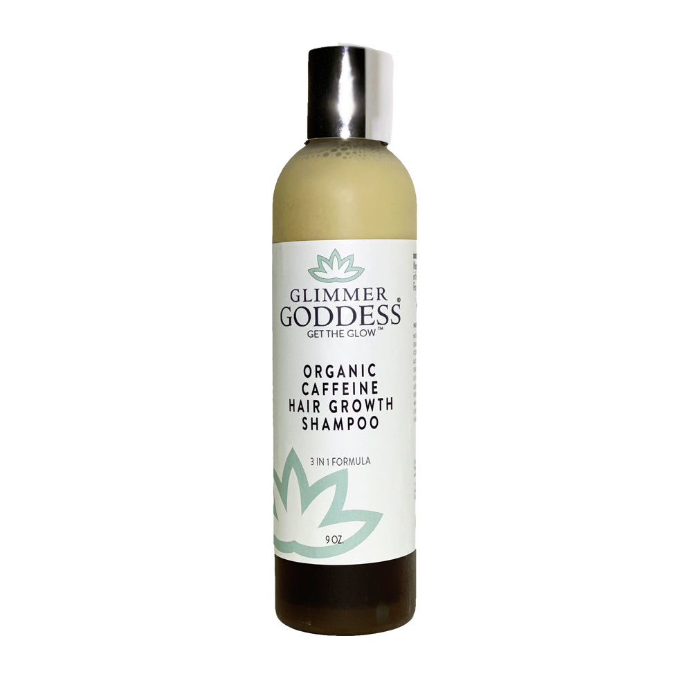 A bottle of Organic Caffeine Hair Growth Shampoo with a fresh, natural design, surrounded by rosemary and peppermint leaves.