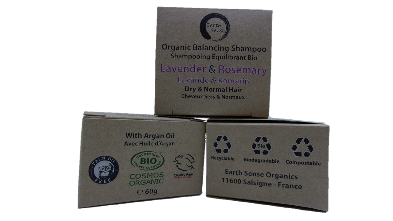 Organic Certified Balancing Solid Shampoo bar with Lavender and Rosemary, ideal for dry hair, displayed on a natural wooden background.