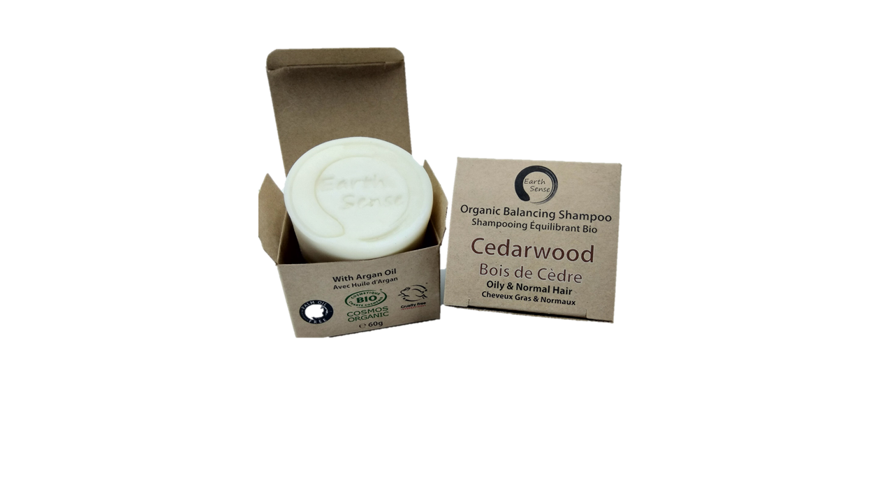 Organic Certified Solid Shampoo bar with Cedarwood scent, suitable for oily and all hair types, displayed on a natural wooden background.