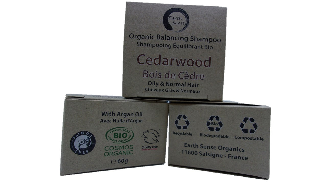 Organic Certified Solid Shampoo bar with Cedarwood scent, suitable for oily and all hair types, displayed on a natural wooden background.