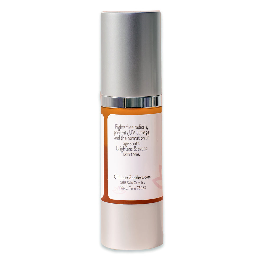 A bottle of Organic Dark Spot Serum with a dropper, surrounded by natural ingredients like Bearberry leaves and vitamins.