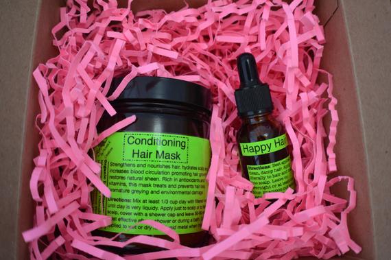 Organic Hair Care Kit featuring a Conditioning Hair Mask and Happy Hair Oil in eco-friendly packaging, showcasing natural ingredients.