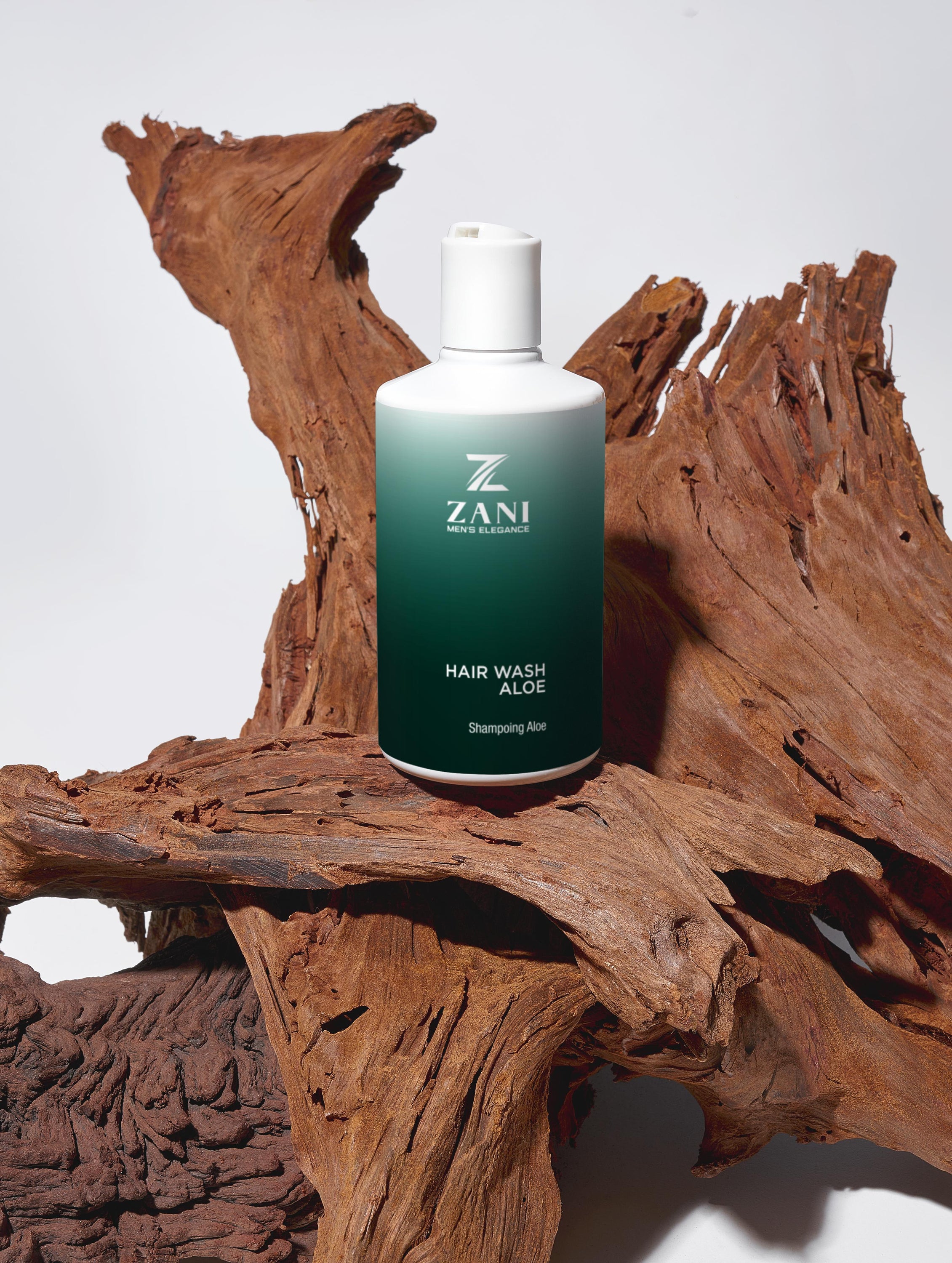 A bottle of Elite Hair Wash Aloe, a luxurious men's shampoo with aloe vera and green tea extract, designed for hydration and protection.