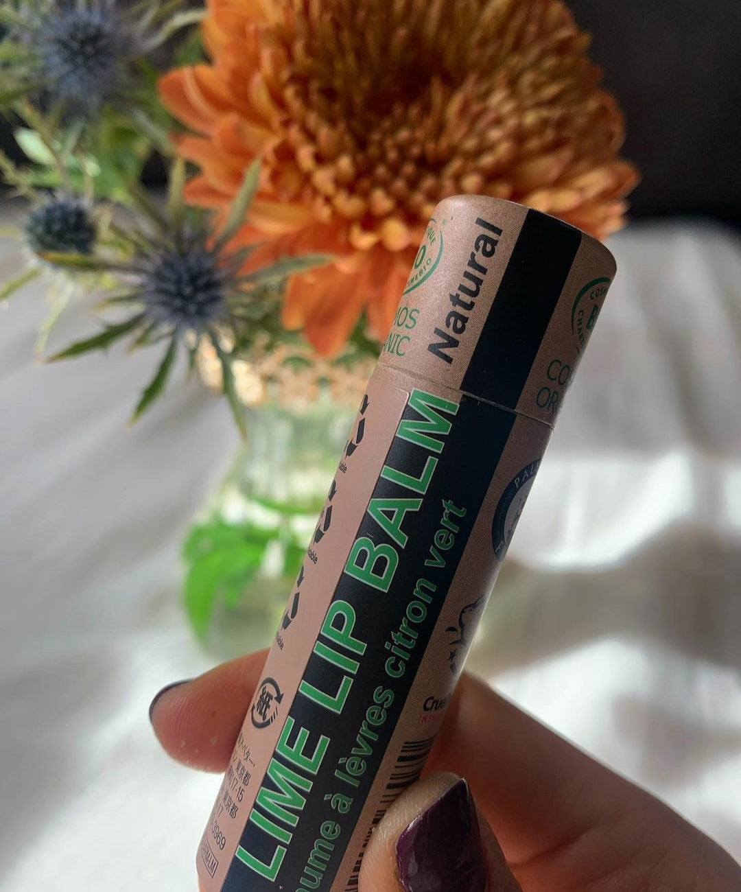 Organic Lime Lip Balm in a paper tube, showcasing its natural ingredients and eco-friendly packaging.